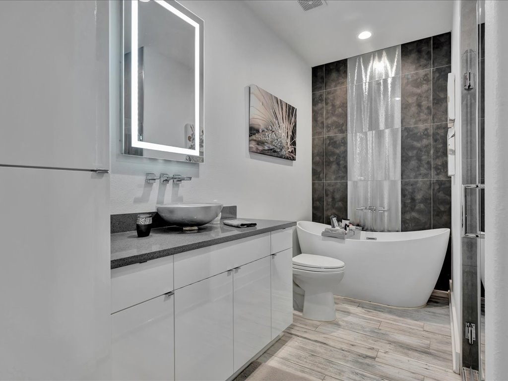129 White Oak Loop Lufkin, TX 75901 - Photo 10 of 50 a bathroom with a granite countertop sink mirror vanity and toilet