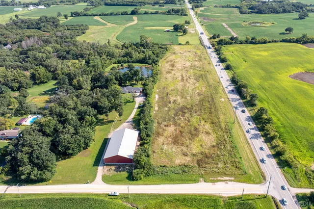 an aerial view of residential houses with outdoor space
