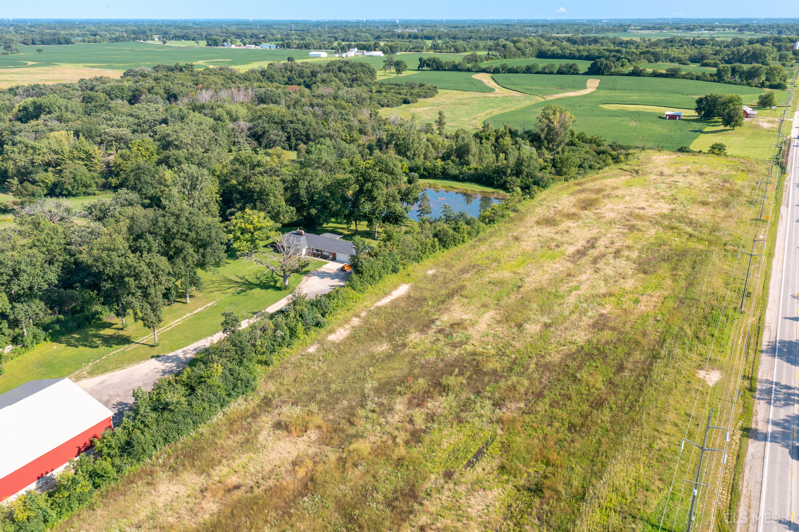 0 Rt 47 & Hercules Rd Highway Woodstock, IL 60098 - Photo 10 of 12 a view of a lake with a yard