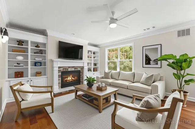 a living room with furniture a fireplace and a flat screen tv