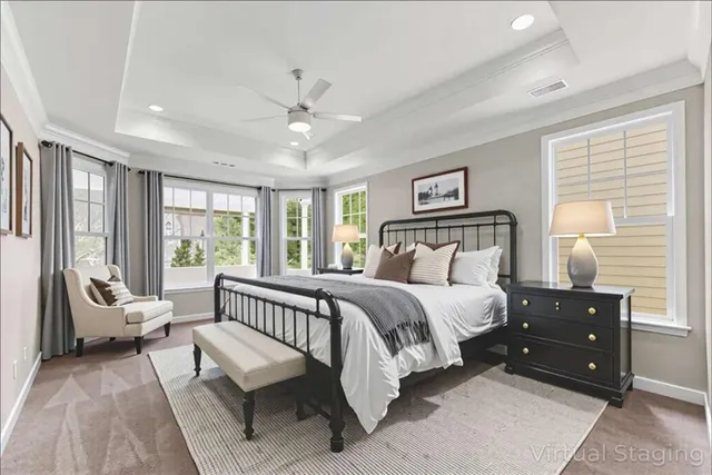 a view of an empty room with window and closet area