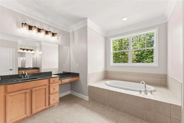 an empty room with closet and fan