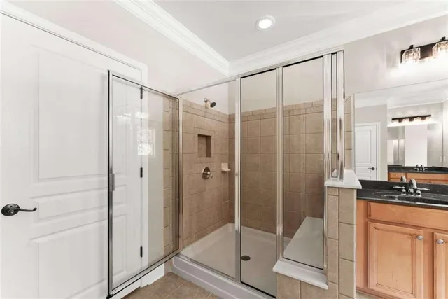 a bathroom with a toilet a sink a vanity and mirror