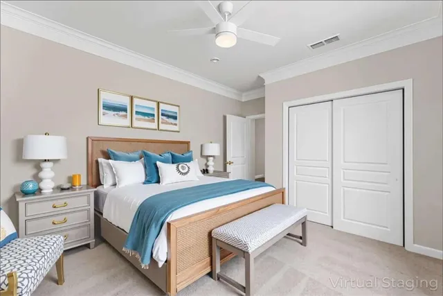 a bedroom with a large bed and a chandelier