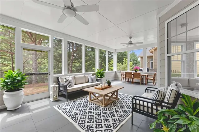 an aerial view of residential house with outdoor space and trees all around