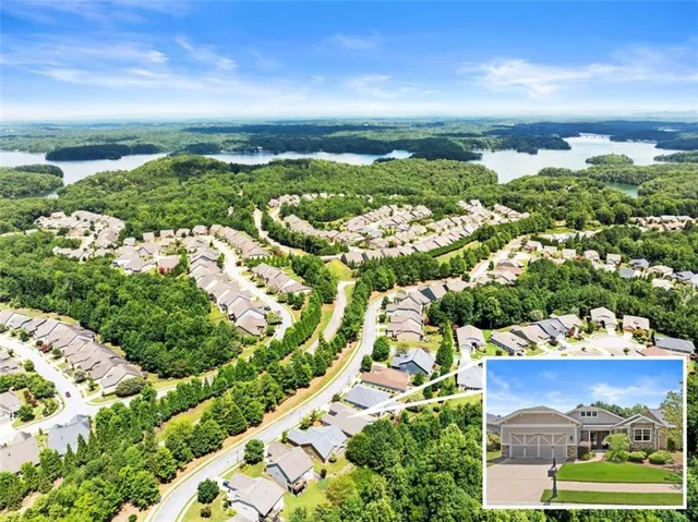 an aerial view of a house with a lake view