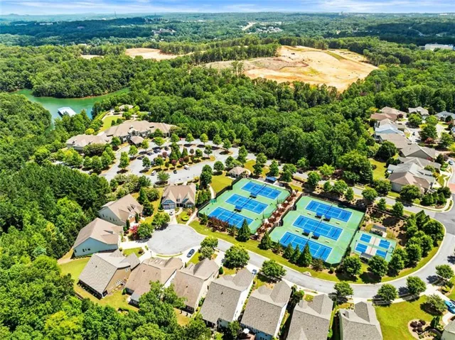a view of a lake with a table and chairs