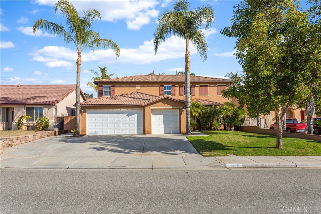 31578 Palomar Road Menifee, CA 92584 - Photo 1 of 1 a view of a house with a yard and palm trees
