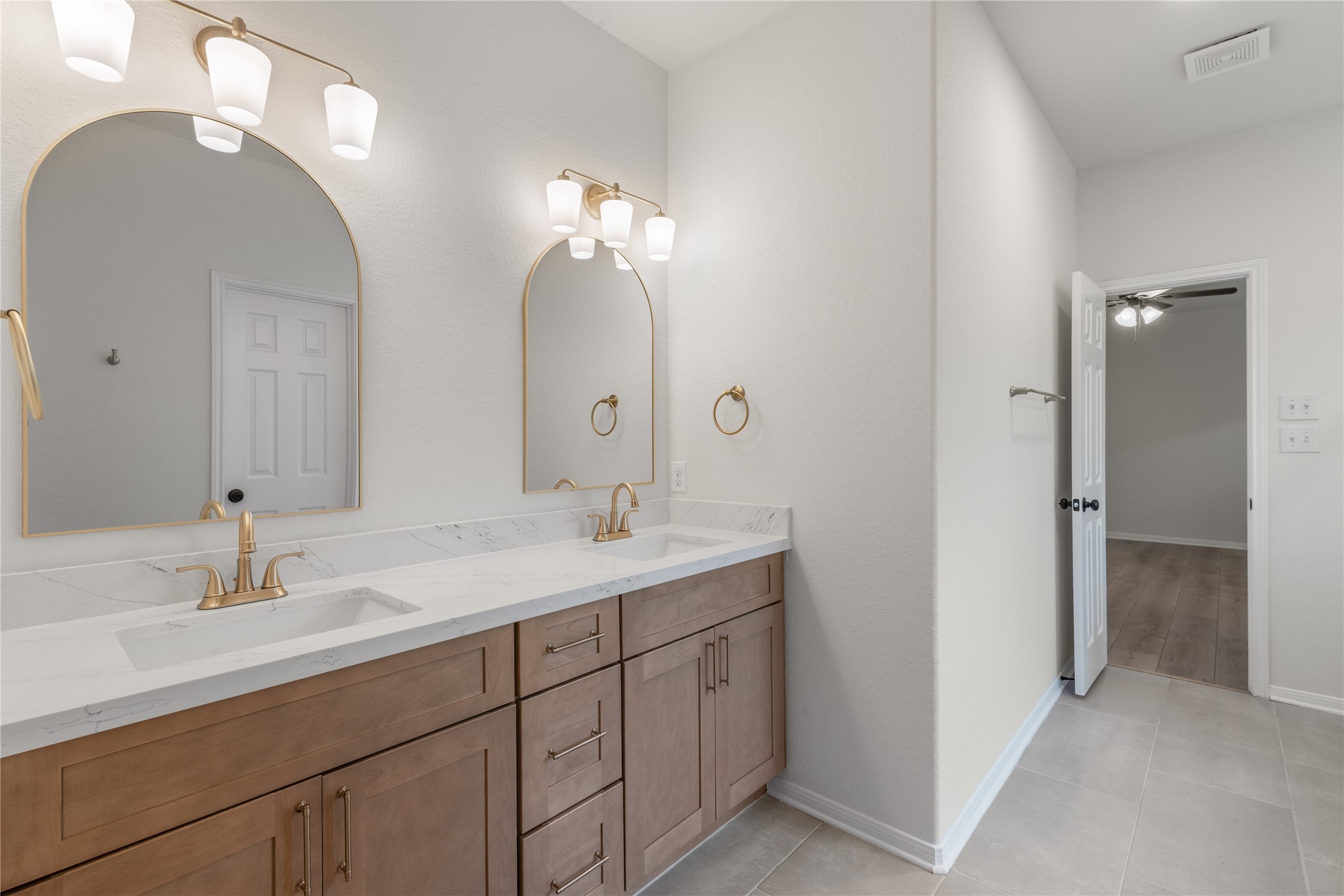 714 Northridge Terrace Lane Spring, TX 77373 - Photo 21 of 42 Primary bathroom updated with new cabinetry, quartz countertops, new sinks, and new fixtures!