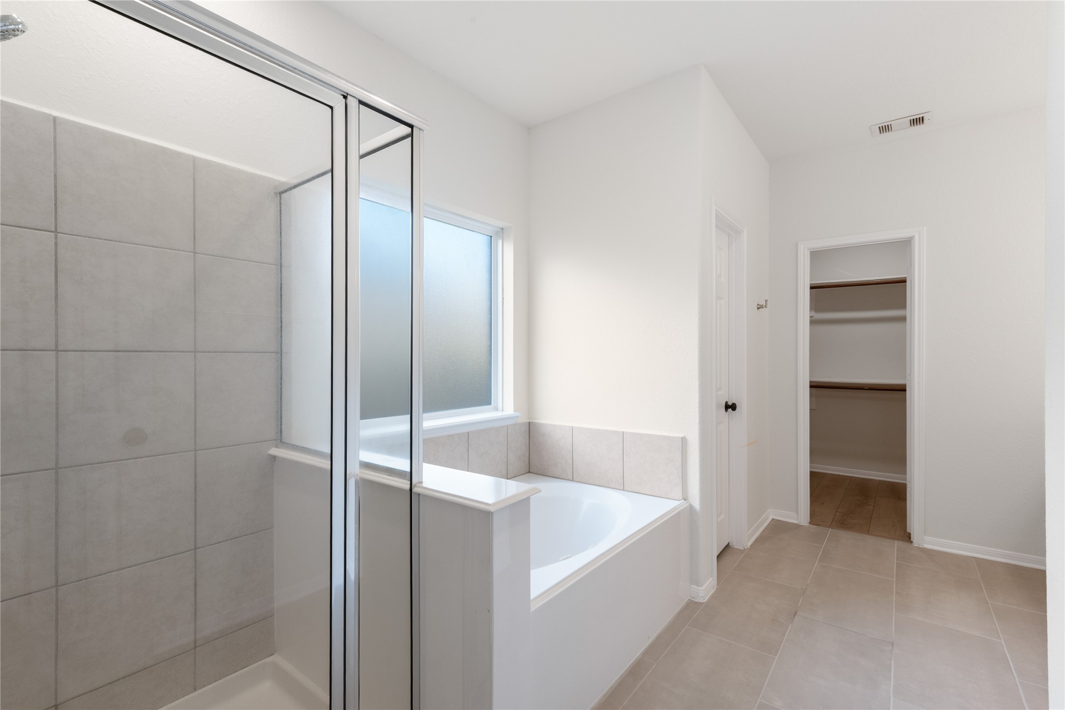 714 Northridge Terrace Lane Spring, TX 77373 - Photo 22 of 42 Primary bathroom features a stand-up shower and separate tub.