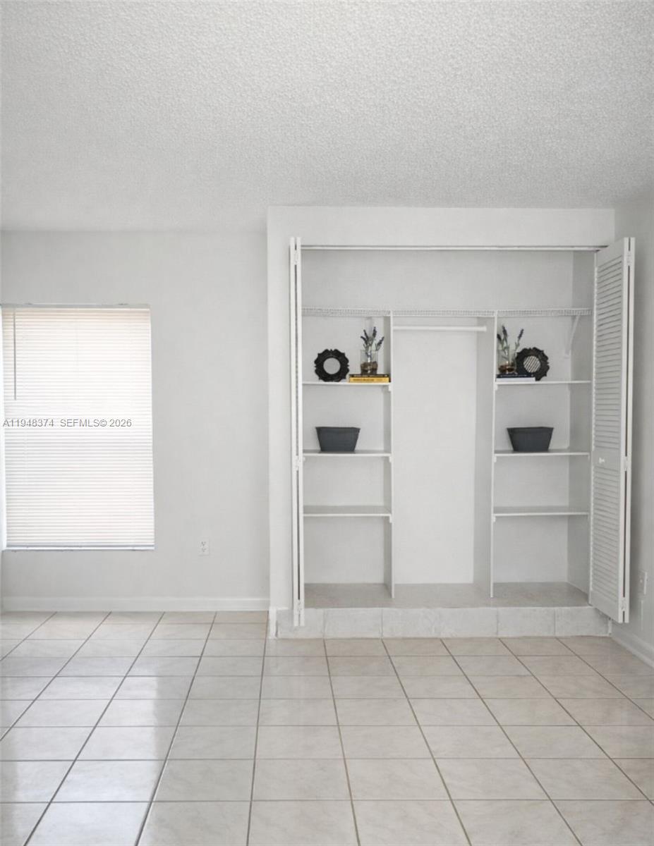 4845 Northwest 7th Street, Unit 1065 Miami, FL 33126 - Photo 4 of 6 a view of an empty room