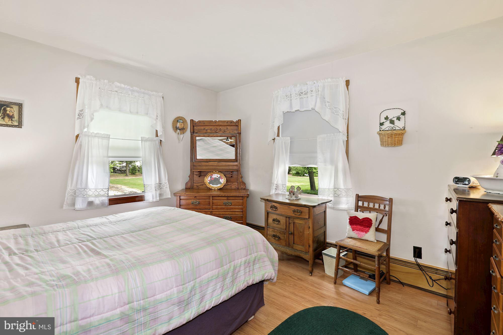 161 Carranza Road Tabernacle, NJ 08088 - Photo 17 of 22 a bedroom with a bed dresser and a window