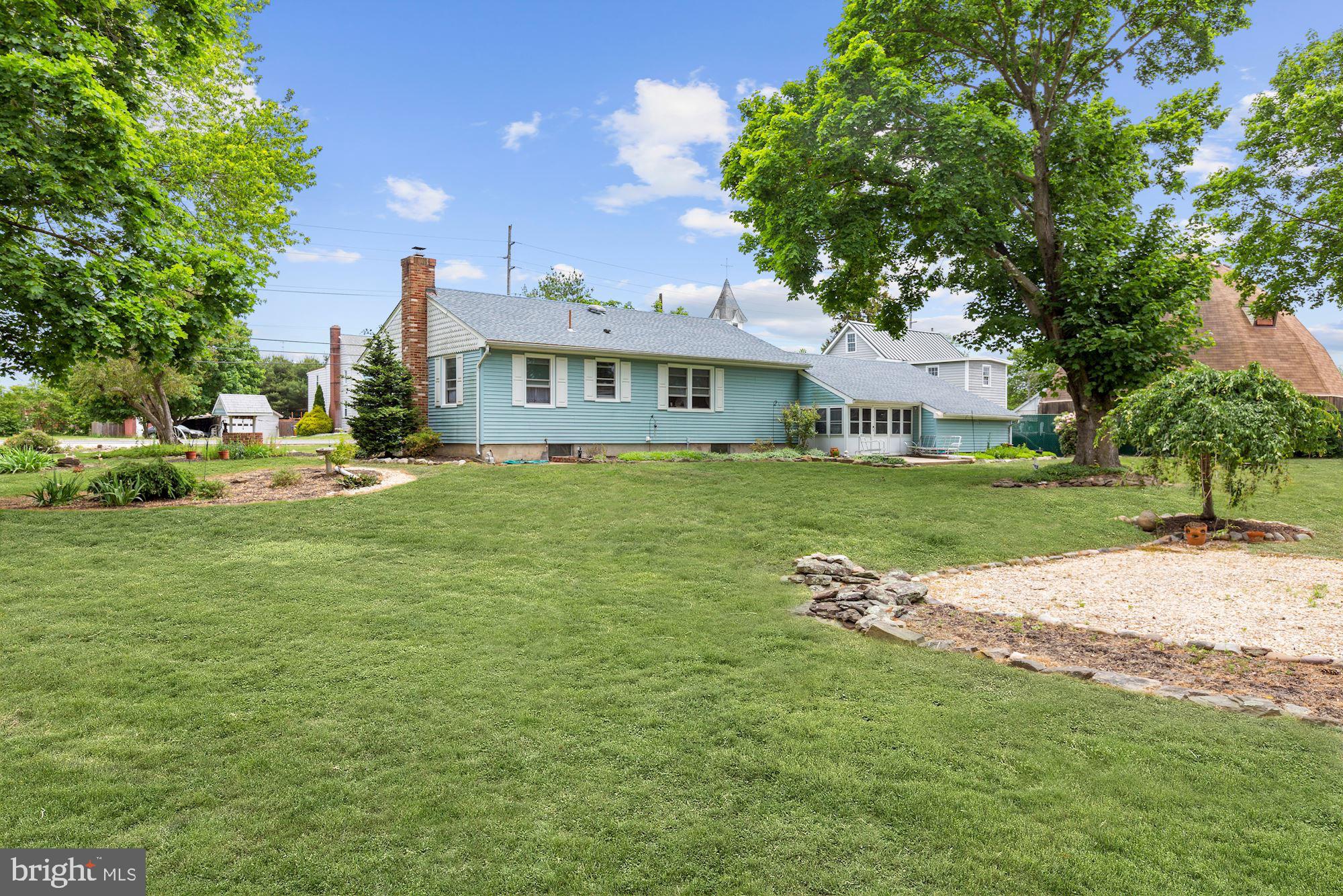 161 Carranza Road Tabernacle, NJ 08088 - Photo 6 of 22 a view of a house with a big yard and large trees