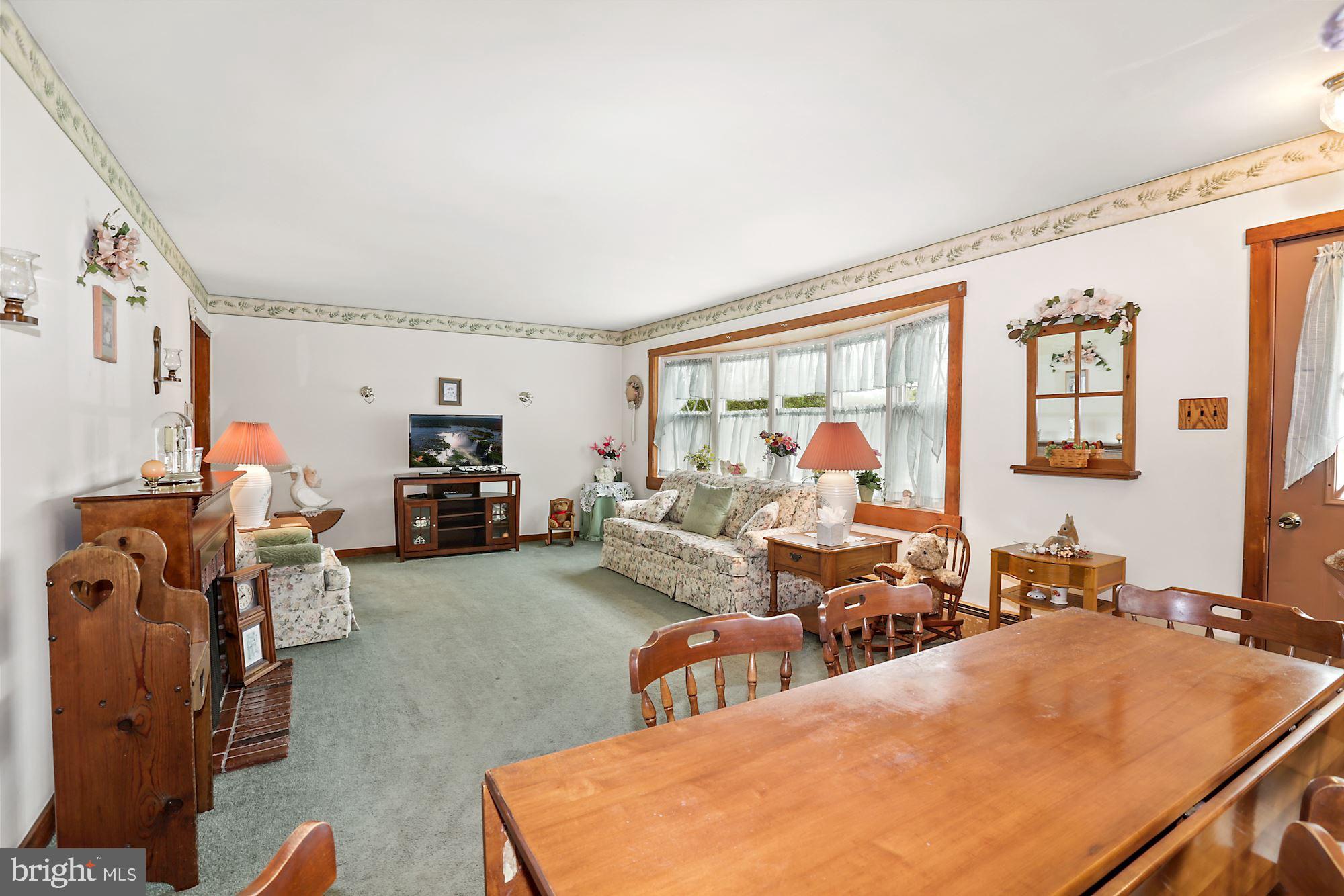 161 Carranza Road Tabernacle, NJ 08088 - Photo 9 of 22 a living room with furniture fireplace and a large window