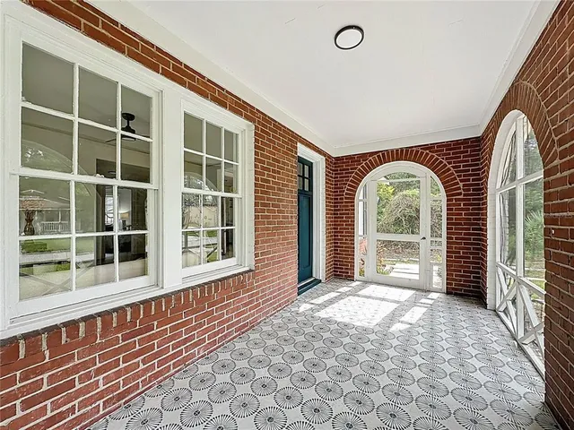 a view of an entryway with a floor to ceiling window
