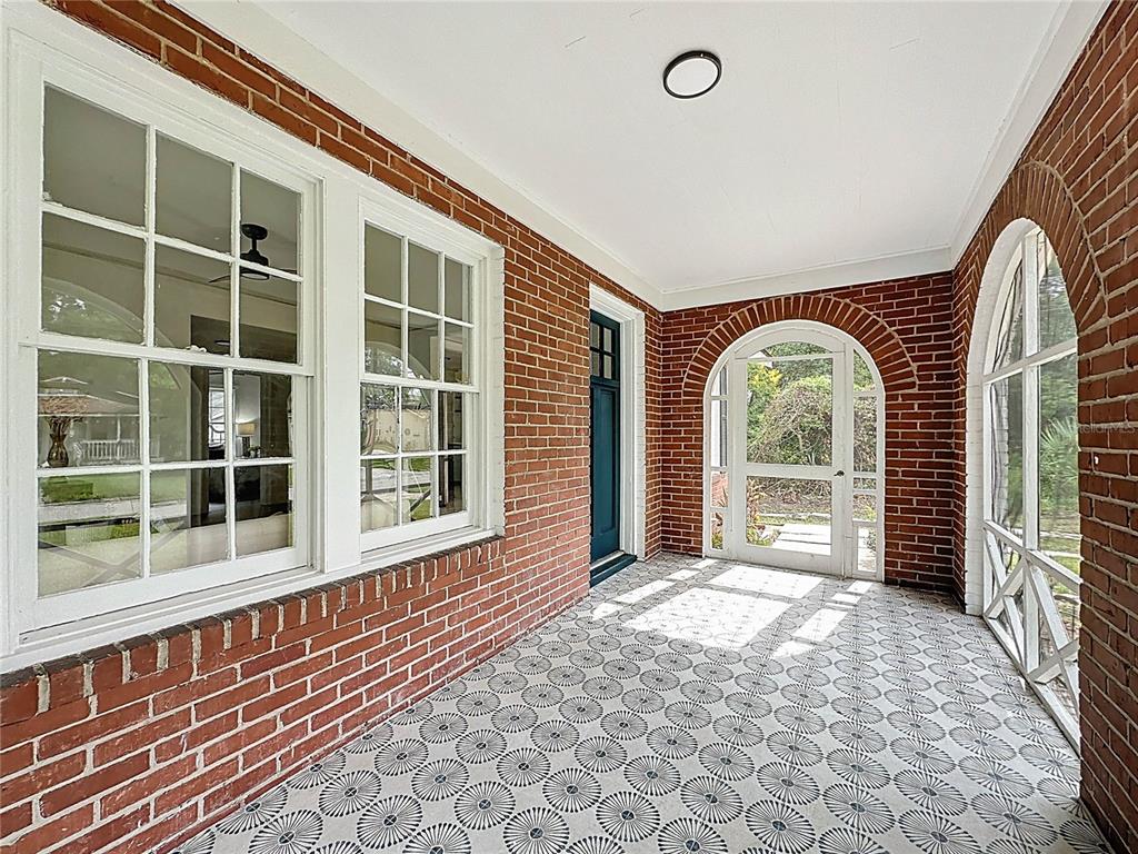 a view of an entryway with a floor to ceiling window