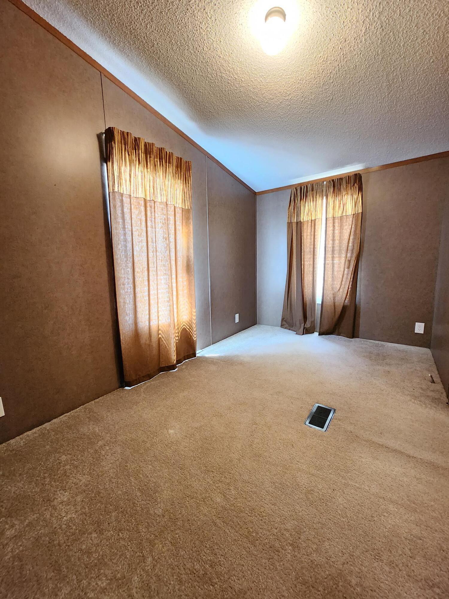5399 Fox Hound Lane Baker, FL 32531 - Photo 11 of 15 an empty room with windows