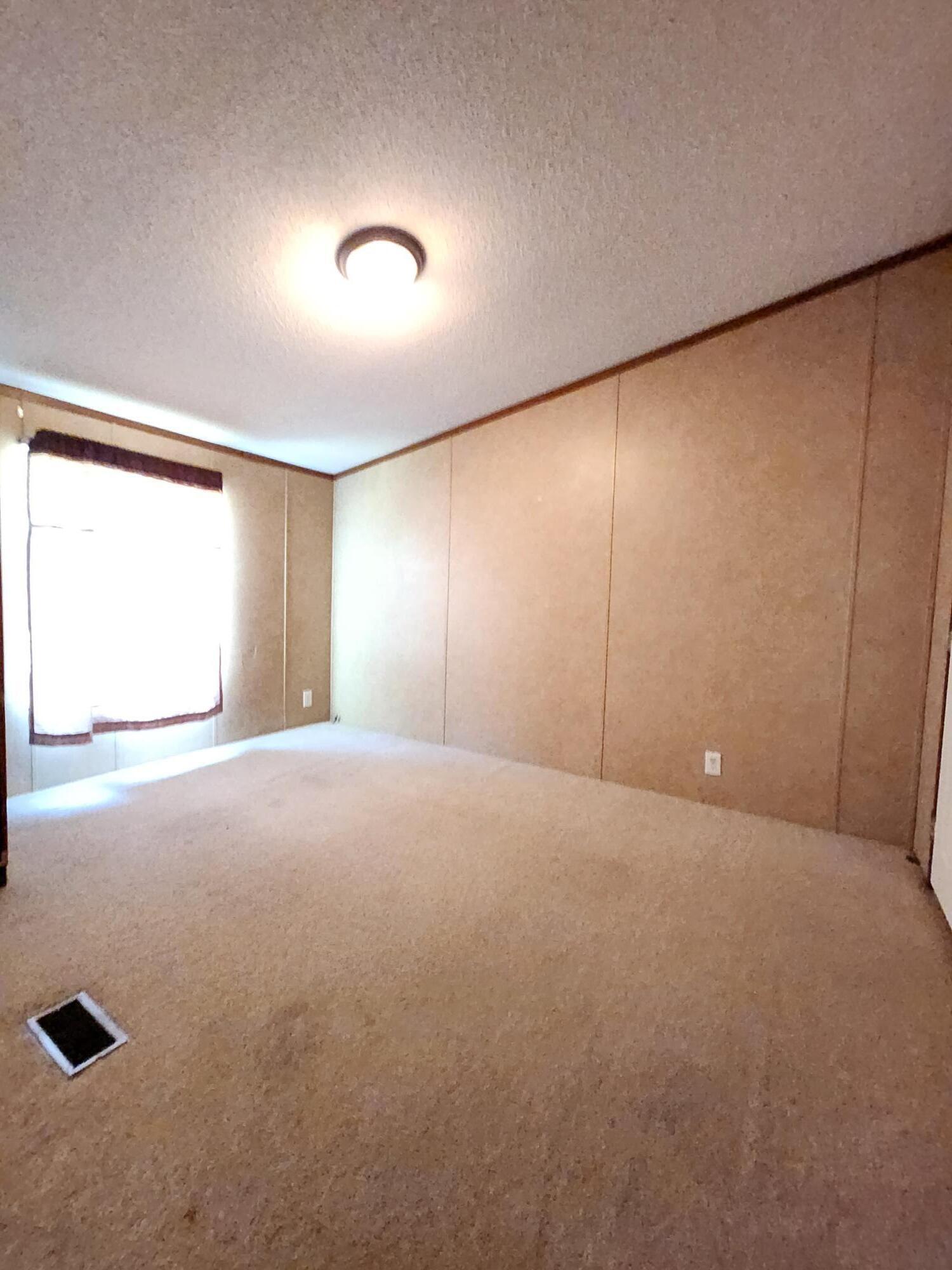 5399 Fox Hound Lane Baker, FL 32531 - Photo 12 of 15 a view of an empty room with a window