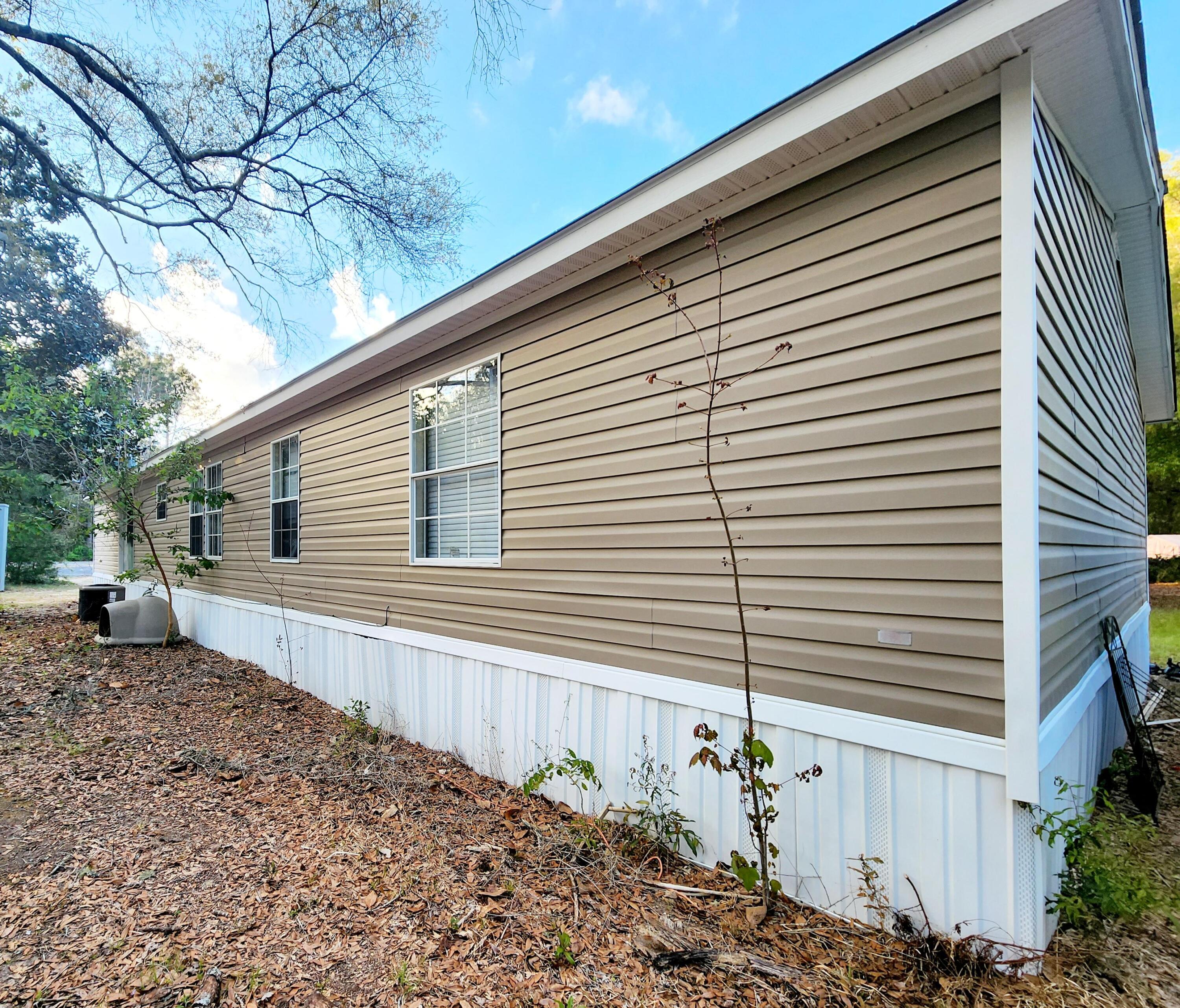 5399 Fox Hound Lane Baker, FL 32531 - Photo 3 of 15 a house view with a backyard space