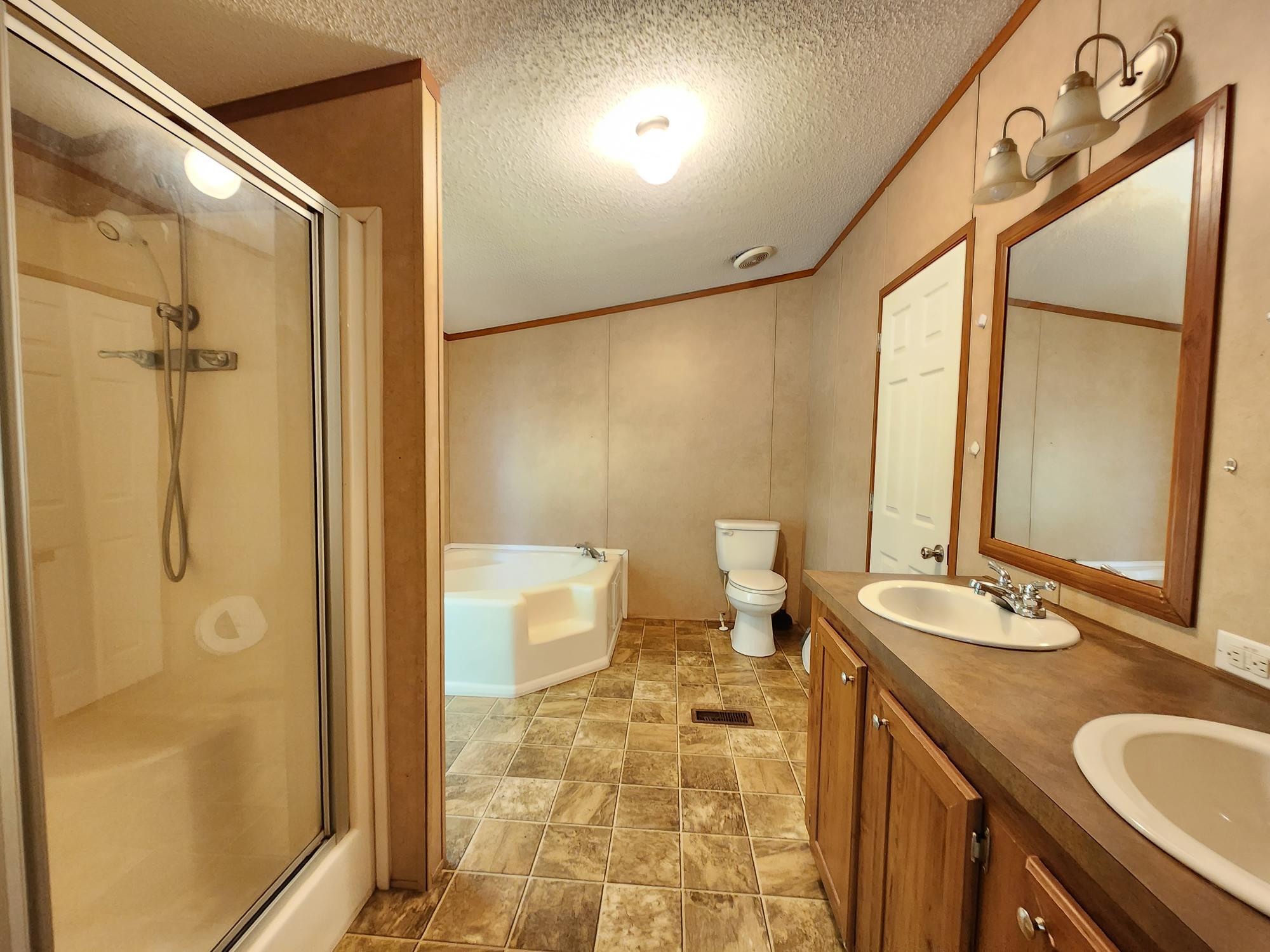 5399 Fox Hound Lane Baker, FL 32531 - Photo 10 of 15 a bathroom with a sink and a mirror