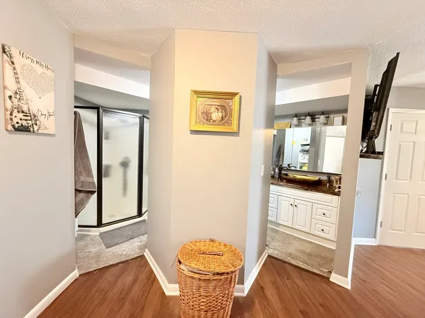 a living room with a stove and a wooden floor