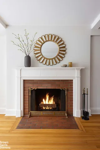 a room with a fireplace and a fireplace