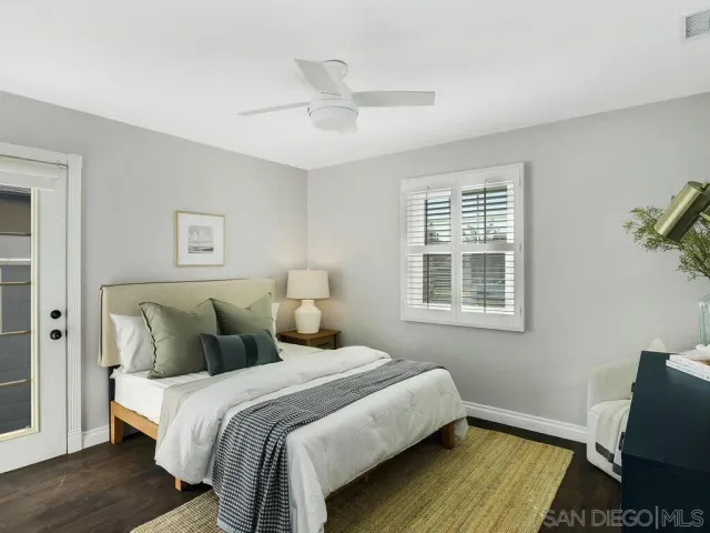 a bedroom with bed and window