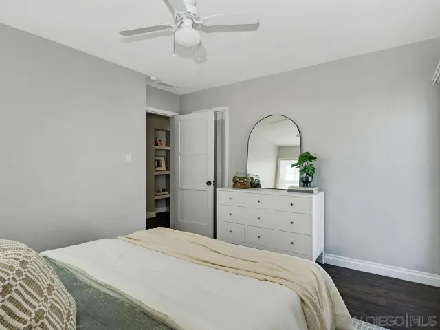 a bedroom with a bed and a dresser