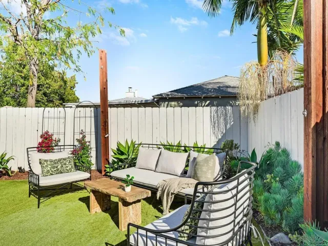 a patio with table and chairs