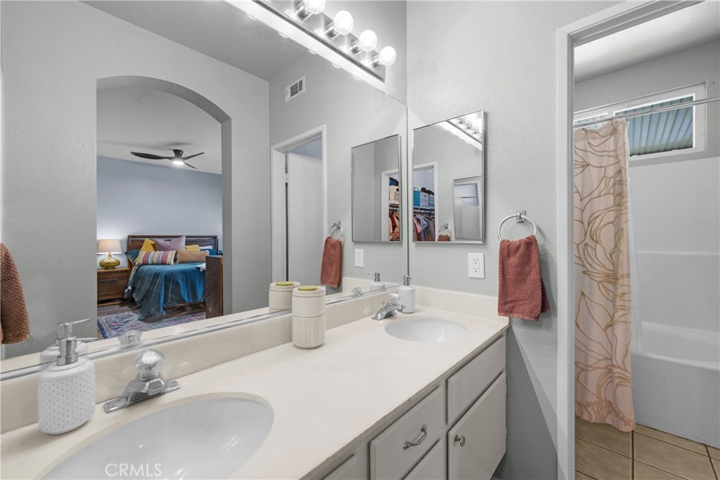 33411 Cam Piedra Rojo Temecula, CA 92592 - Photo 17 of 36 a bathroom with a sink double vanity and a mirror