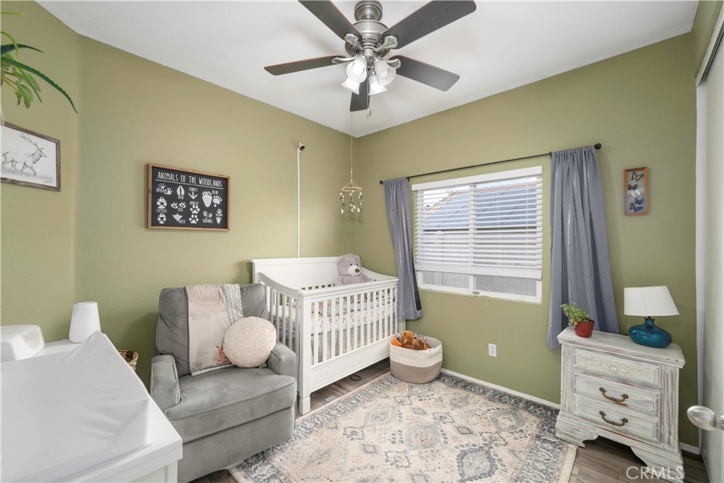 33411 Cam Piedra Rojo Temecula, CA 92592 - Photo 19 of 36 a room with a baby crib furniture and a window