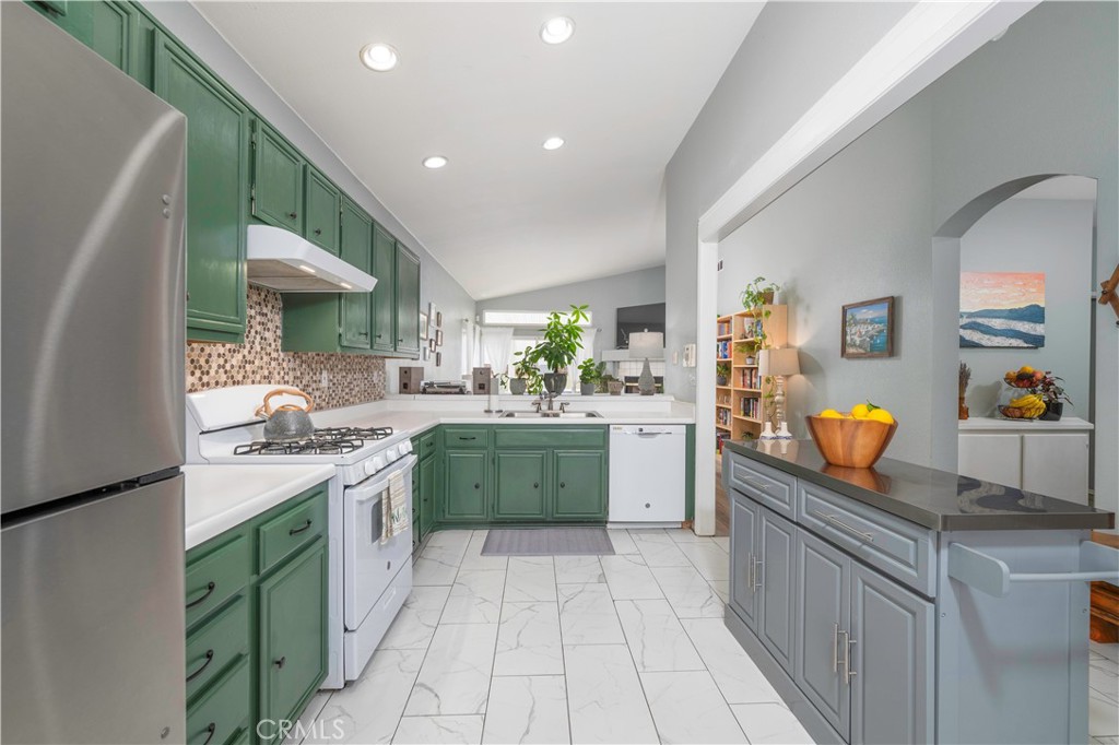 33411 Cam Piedra Rojo Temecula, CA 92592 - Photo 3 of 36 a kitchen with stainless steel appliances granite countertop a stove and cabinets