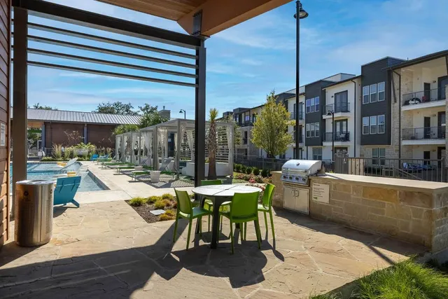 a outdoor space with lots of chairs and wooden floor