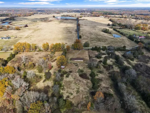a view of a dry yard with mountain