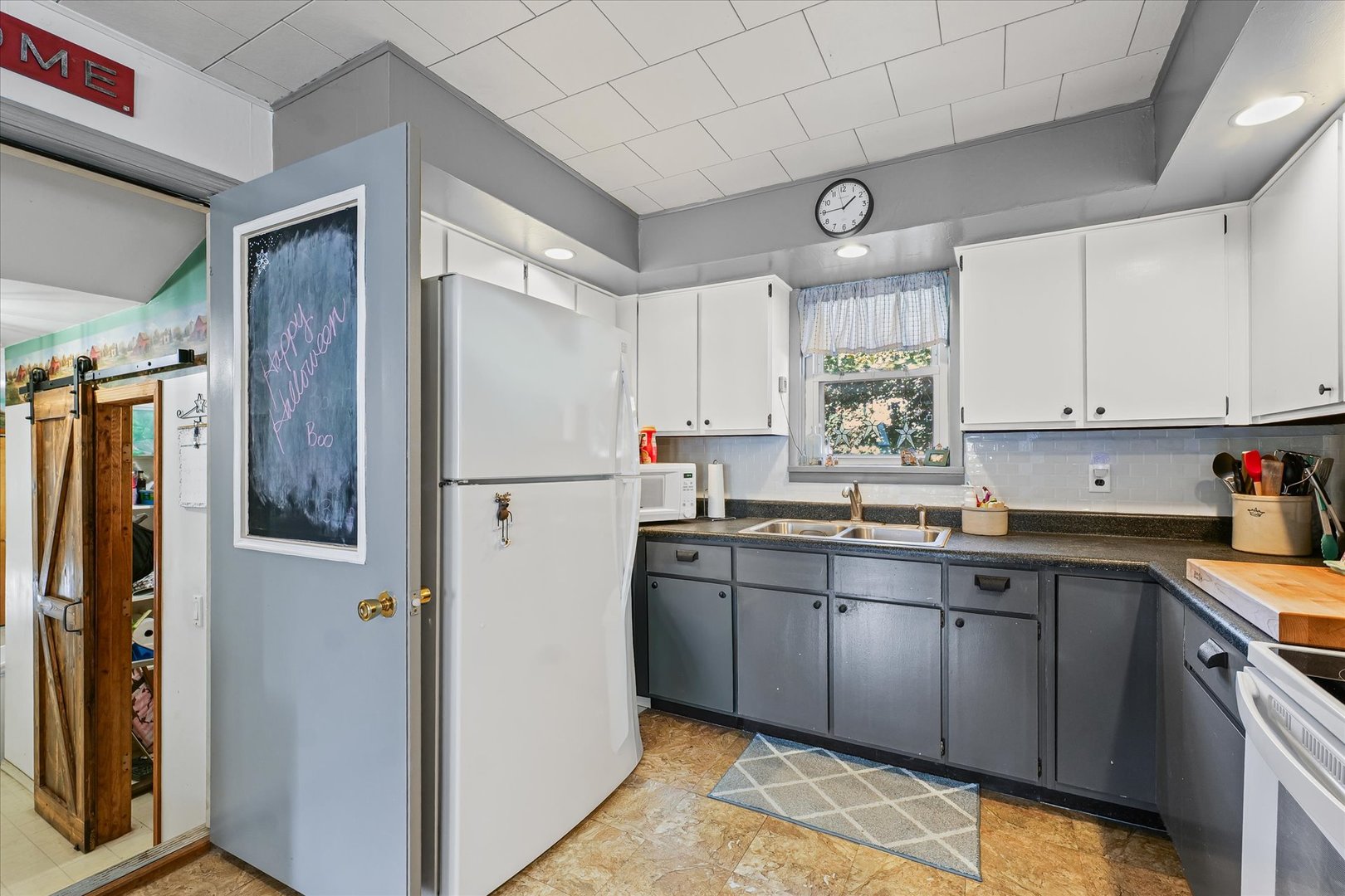 217 North Main Street Roberts, IL 60962 - Photo 15 of 36 a kitchen with stainless steel appliances granite countertop a refrigerator and a sink