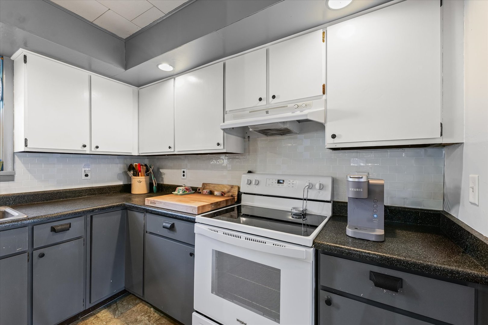 217 North Main Street Roberts, IL 60962 - Photo 17 of 36 a kitchen with stainless steel appliances granite countertop white cabinets and a stove