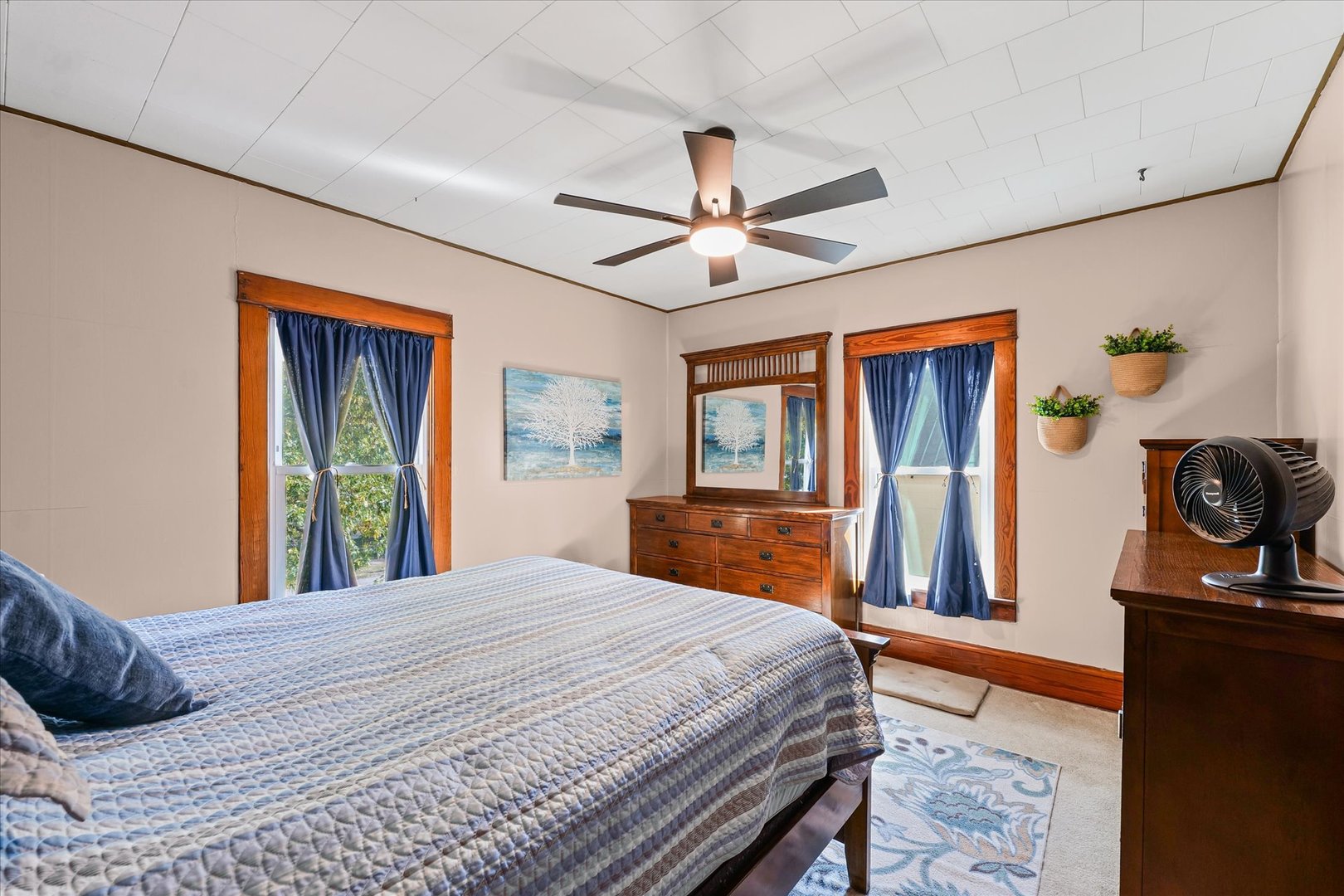 217 North Main Street Roberts, IL 60962 - Photo 21 of 36 a bedroom with a large bed and a dresser