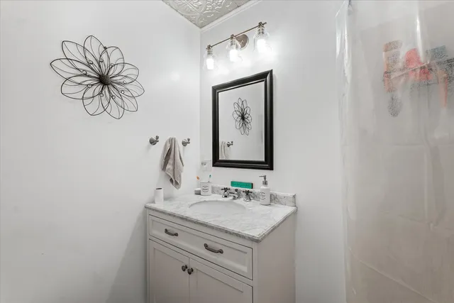 a bathroom with a sink and a mirror
