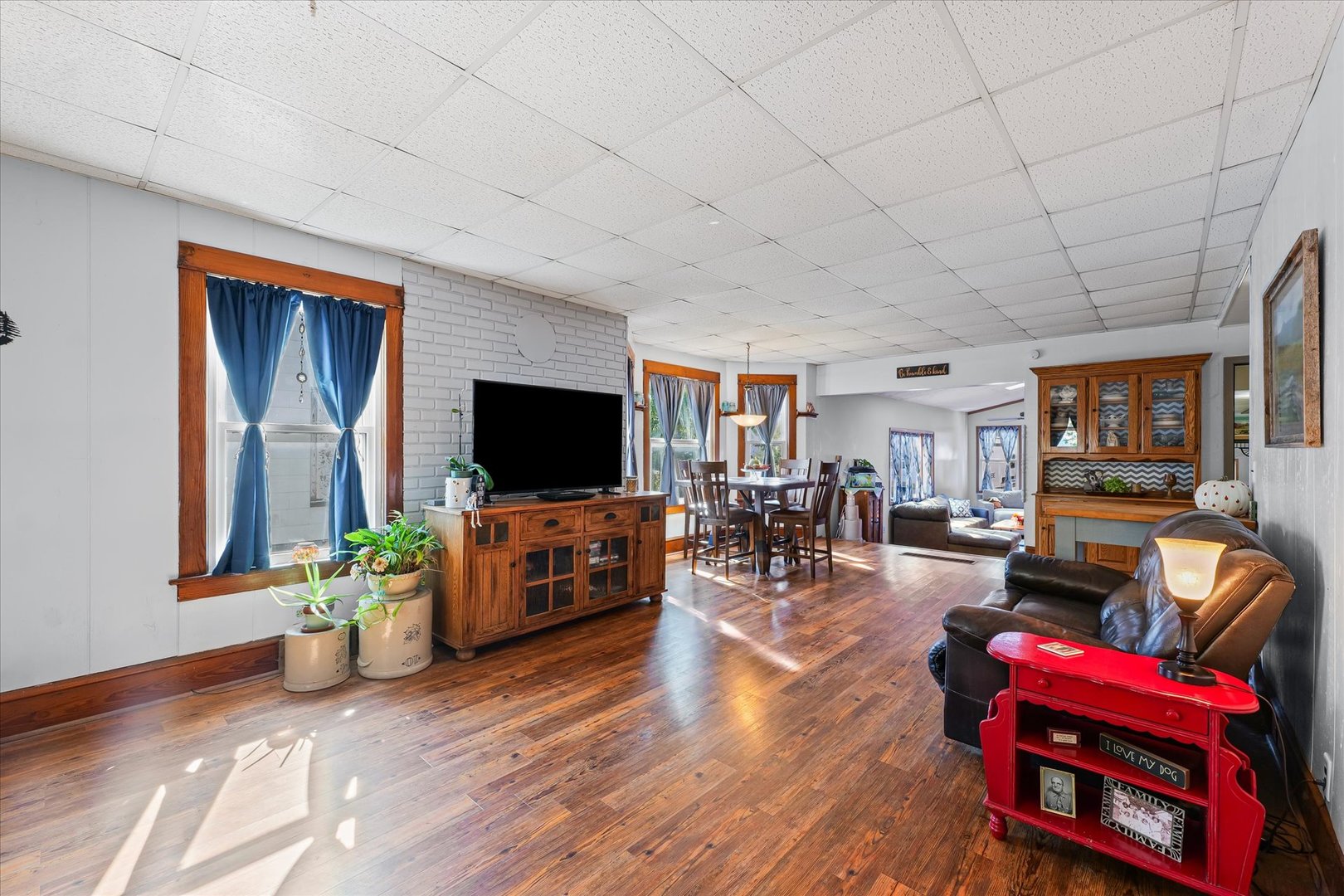 217 North Main Street Roberts, IL 60962 - Photo 7 of 36 a living room with furniture a flat screen tv and a refrigerator