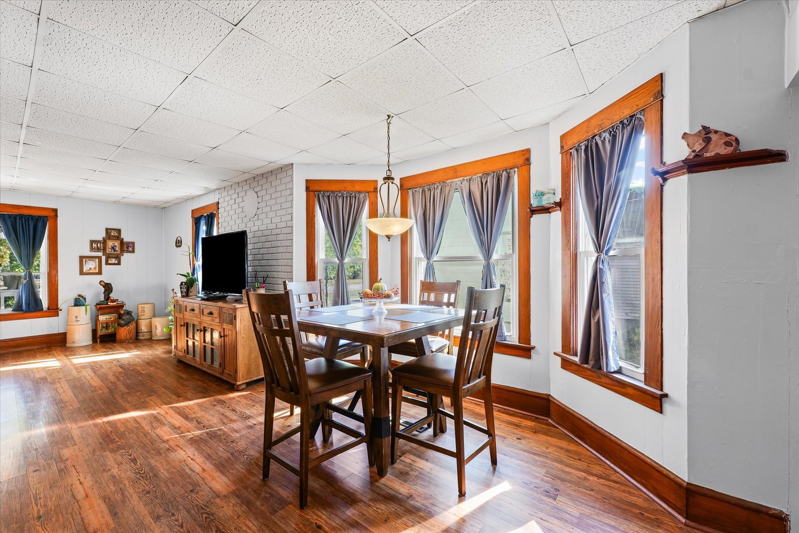 217 North Main Street Roberts, IL 60962 - Photo 10 of 36 a view of a dining room with furniture window and wooden floor