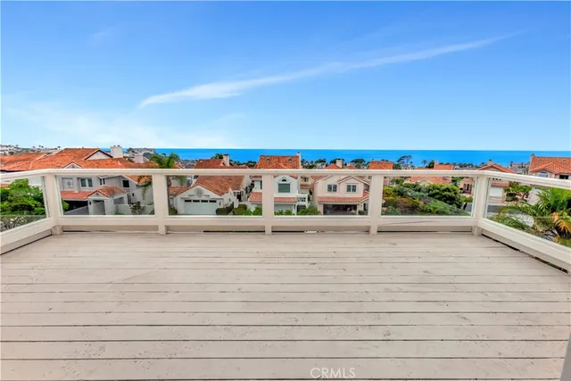 a kitchen with white cabinets stainless steel appliances and sink