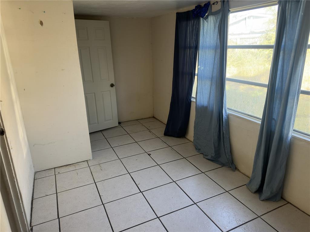 7211 James Street Port Richey, FL 34668 - Photo 9 of 14 a view of an empty room and a window