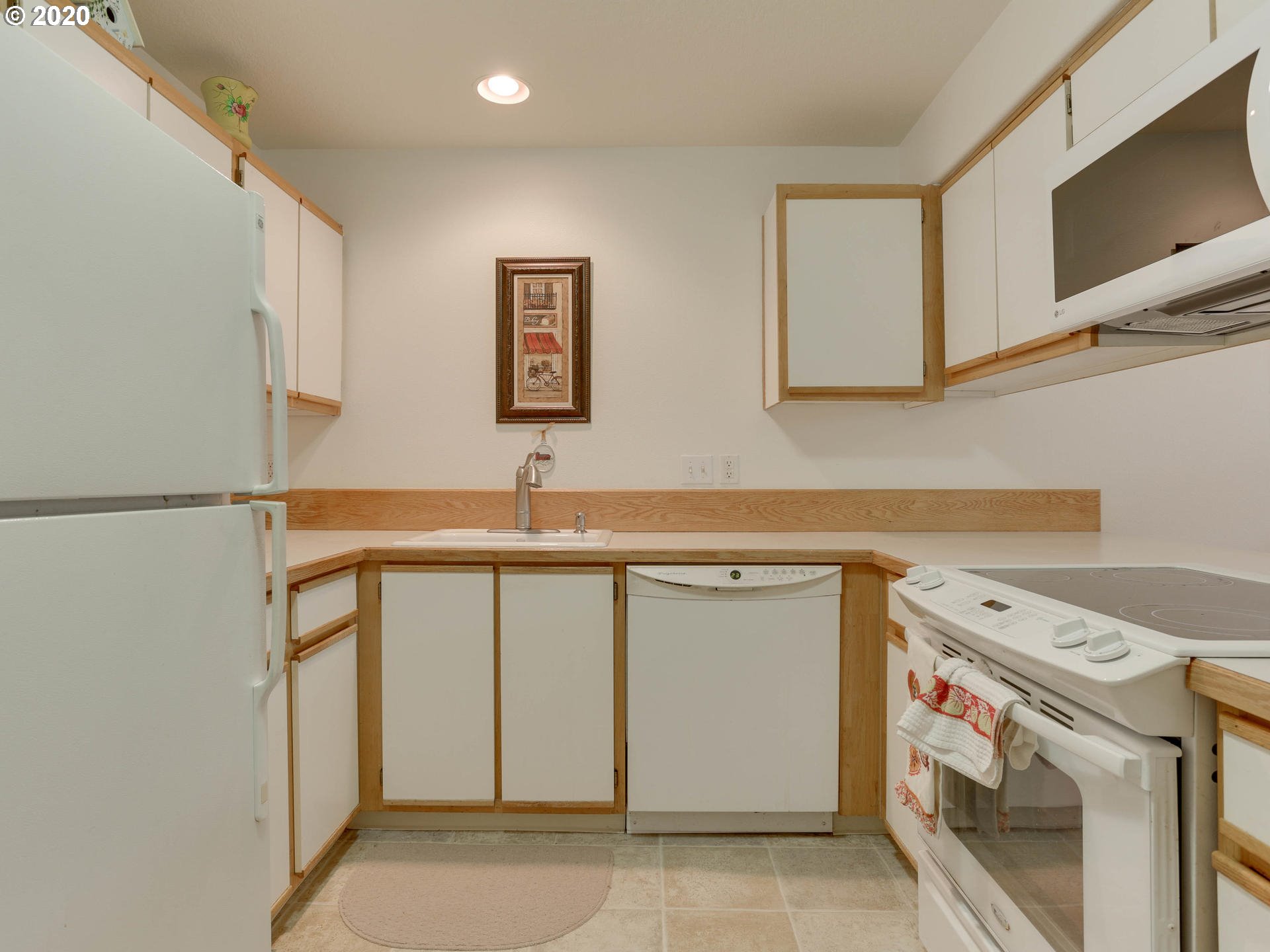 4614 West Powell Boulevard, Unit 261 Gresham, OR 97030 - Photo 13 of 29 a utility room with cabinets washer and dryer
