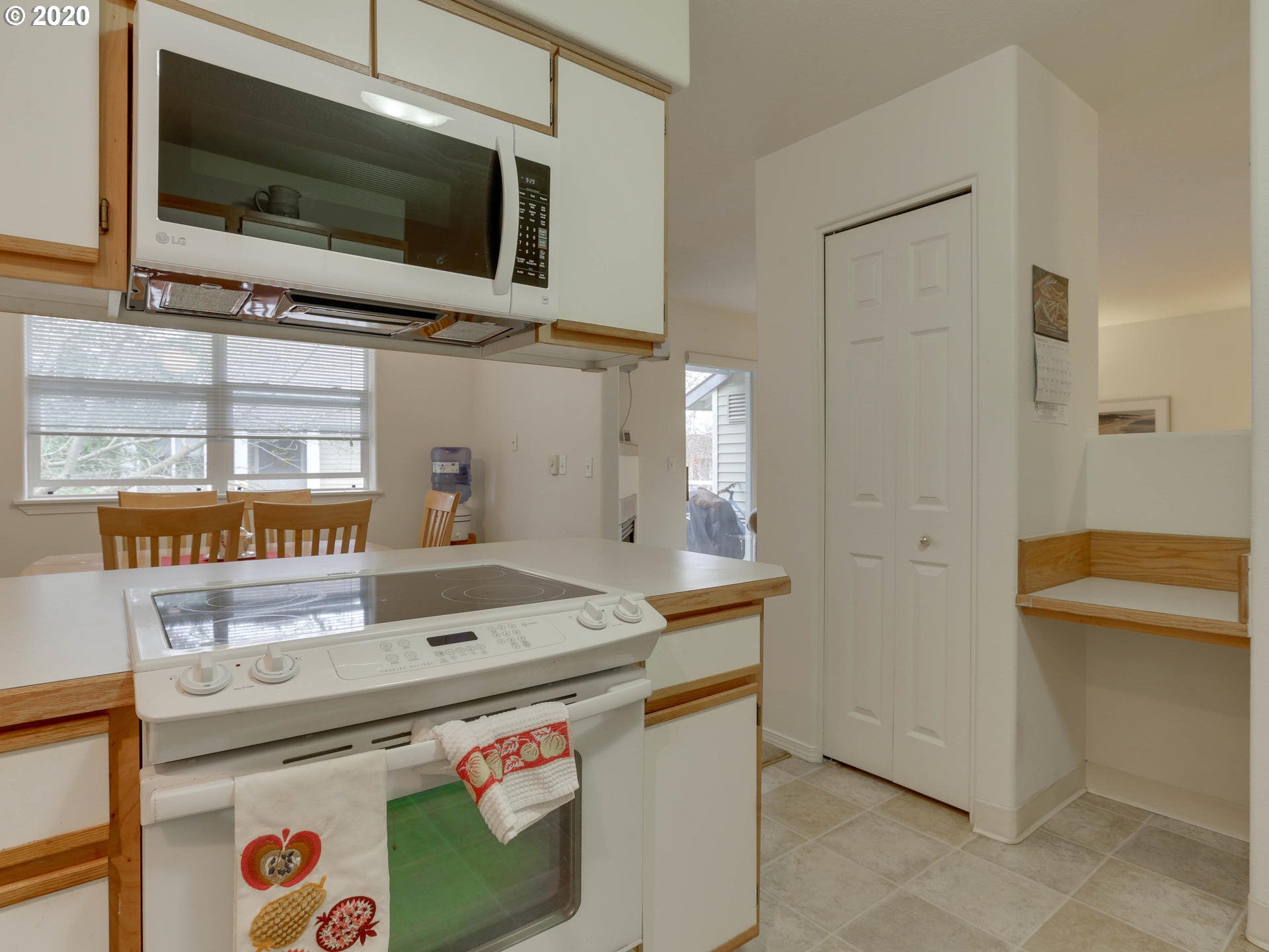 4614 West Powell Boulevard, Unit 261 Gresham, OR 97030 - Photo 15 of 29 a kitchen with stainless steel appliances granite countertop a stove and a microwave
