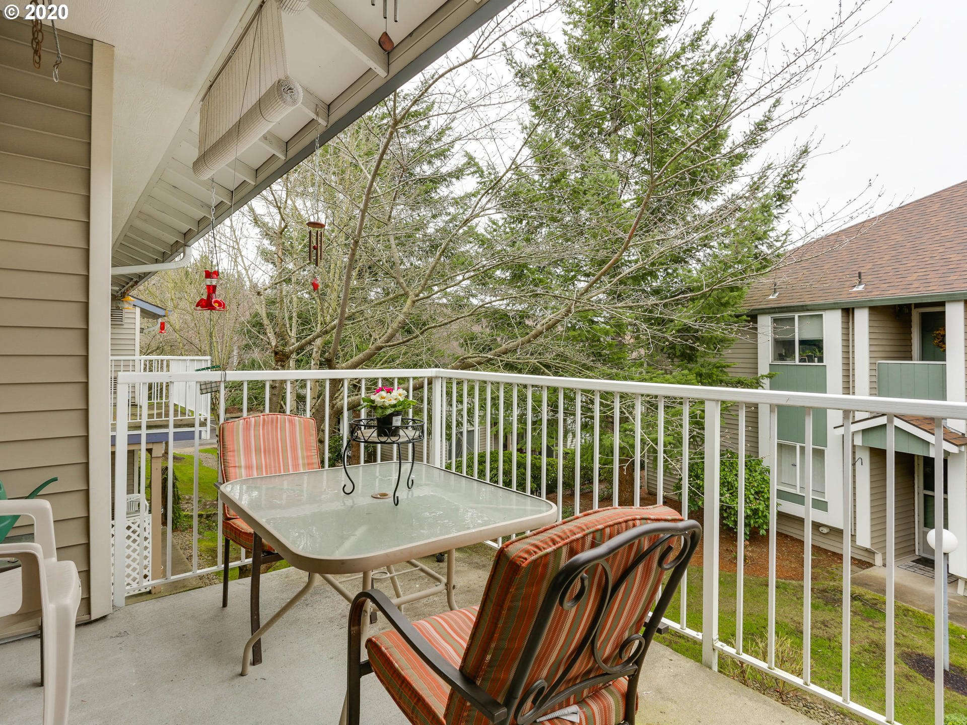 4614 West Powell Boulevard, Unit 261 Gresham, OR 97030 - Photo 16 of 29 a view of a chairs and table in the balcony