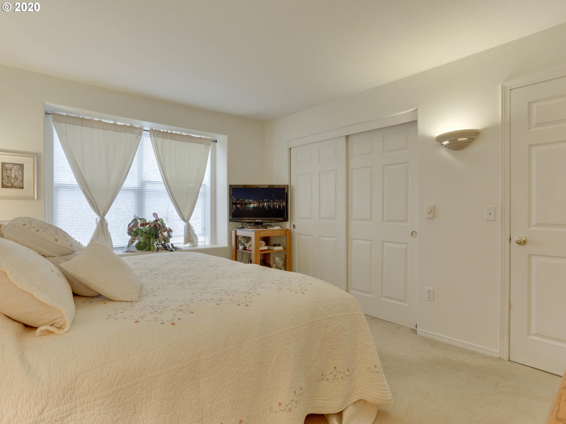 4614 West Powell Boulevard, Unit 261 Gresham, OR 97030 - Photo 19 of 29 a view of a bedroom with furniture and window