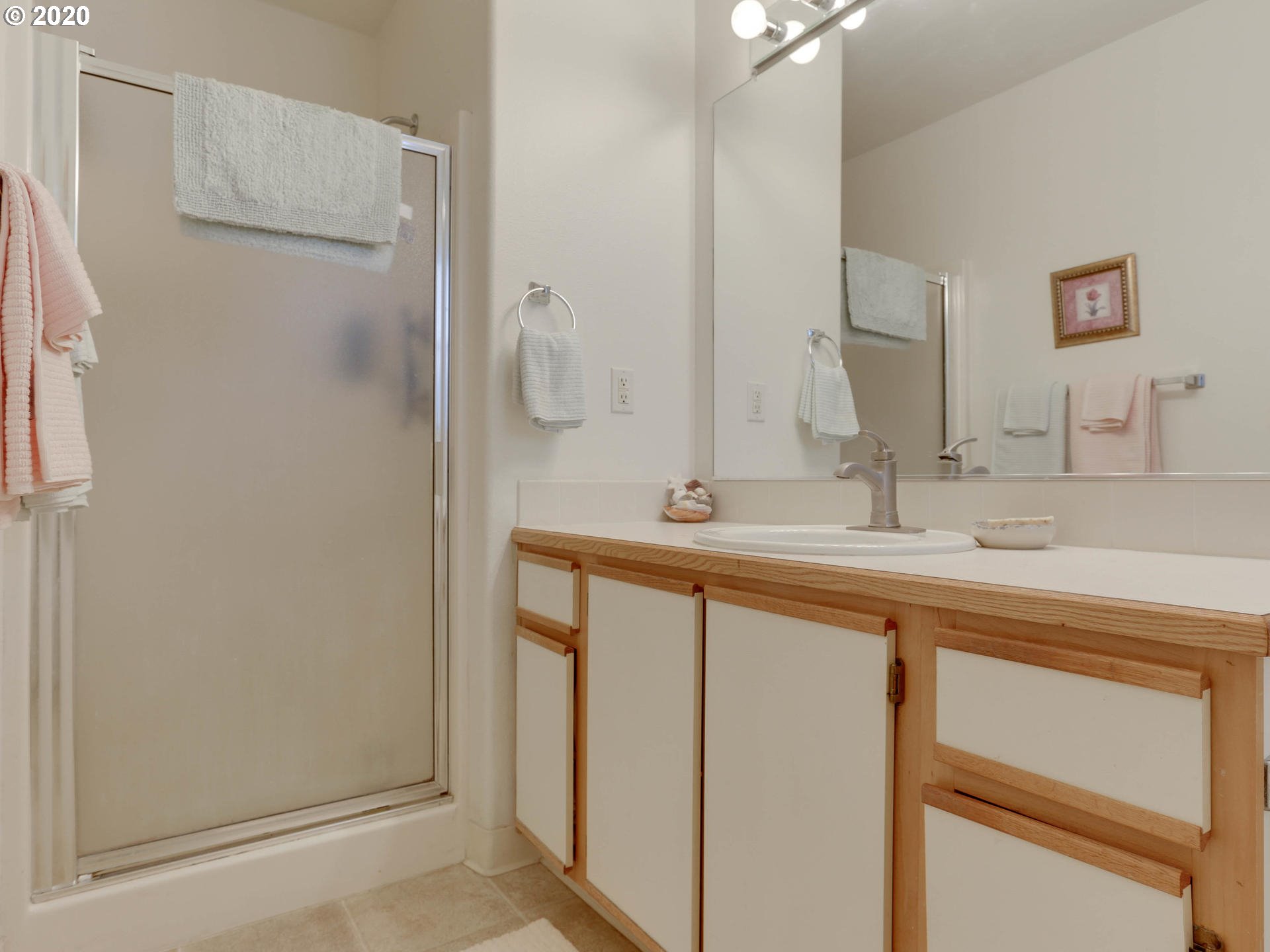 4614 West Powell Boulevard, Unit 261 Gresham, OR 97030 - Photo 22 of 29 a bathroom with a double vanity sink mirror and