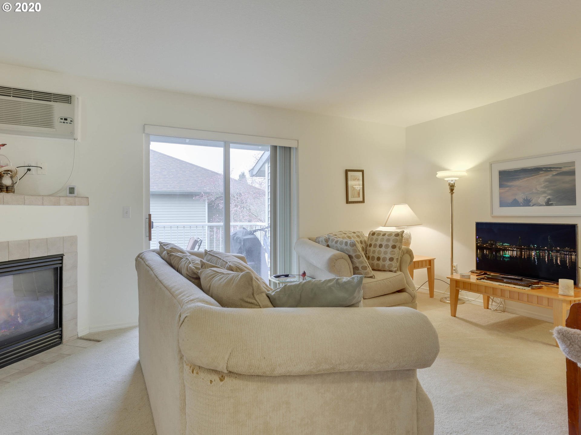 4614 West Powell Boulevard, Unit 261 Gresham, OR 97030 - Photo 4 of 29 a living room with furniture and a fireplace