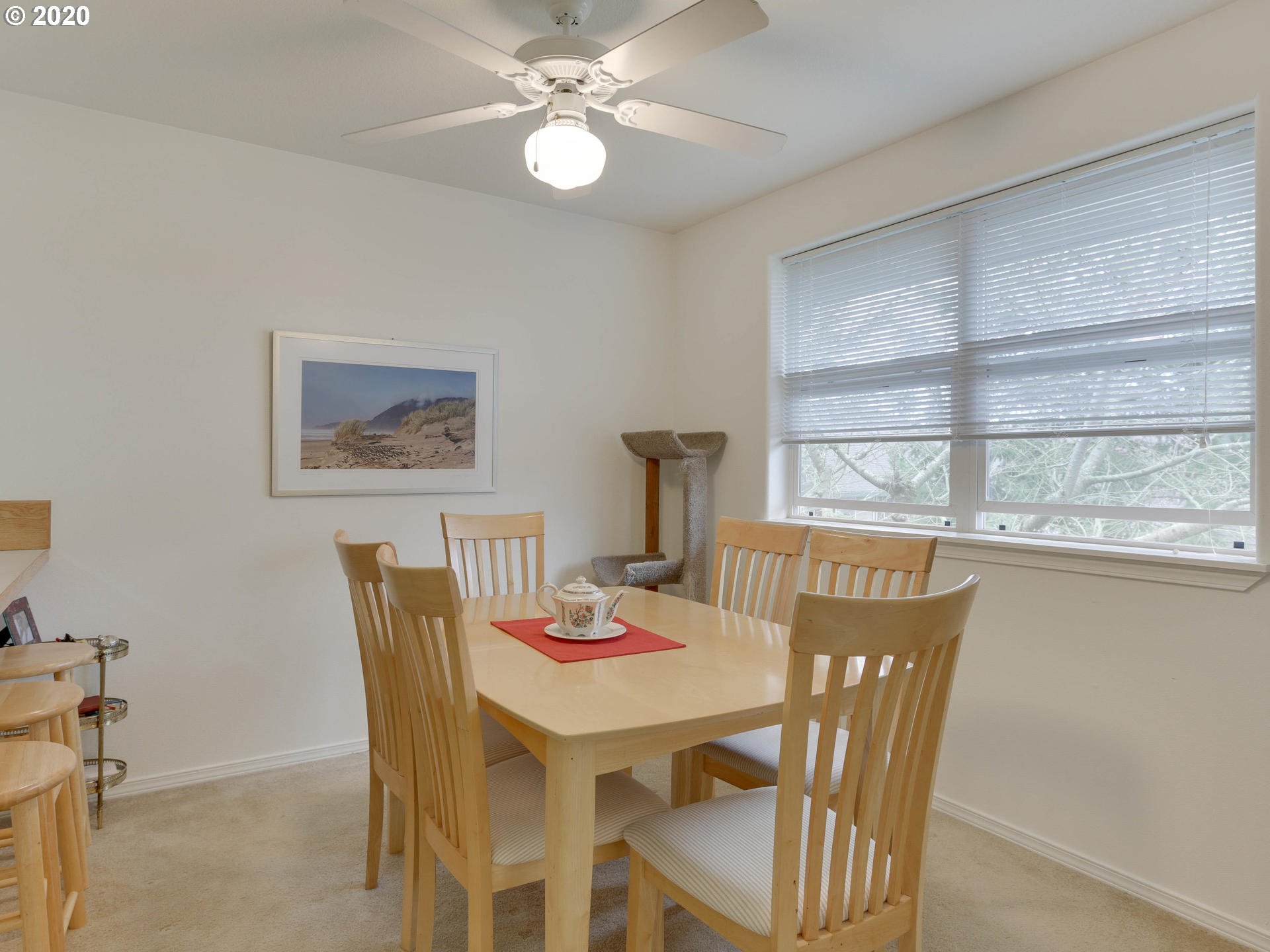 4614 West Powell Boulevard, Unit 261 Gresham, OR 97030 - Photo 10 of 29 a view of a dining room with furniture window and outside view