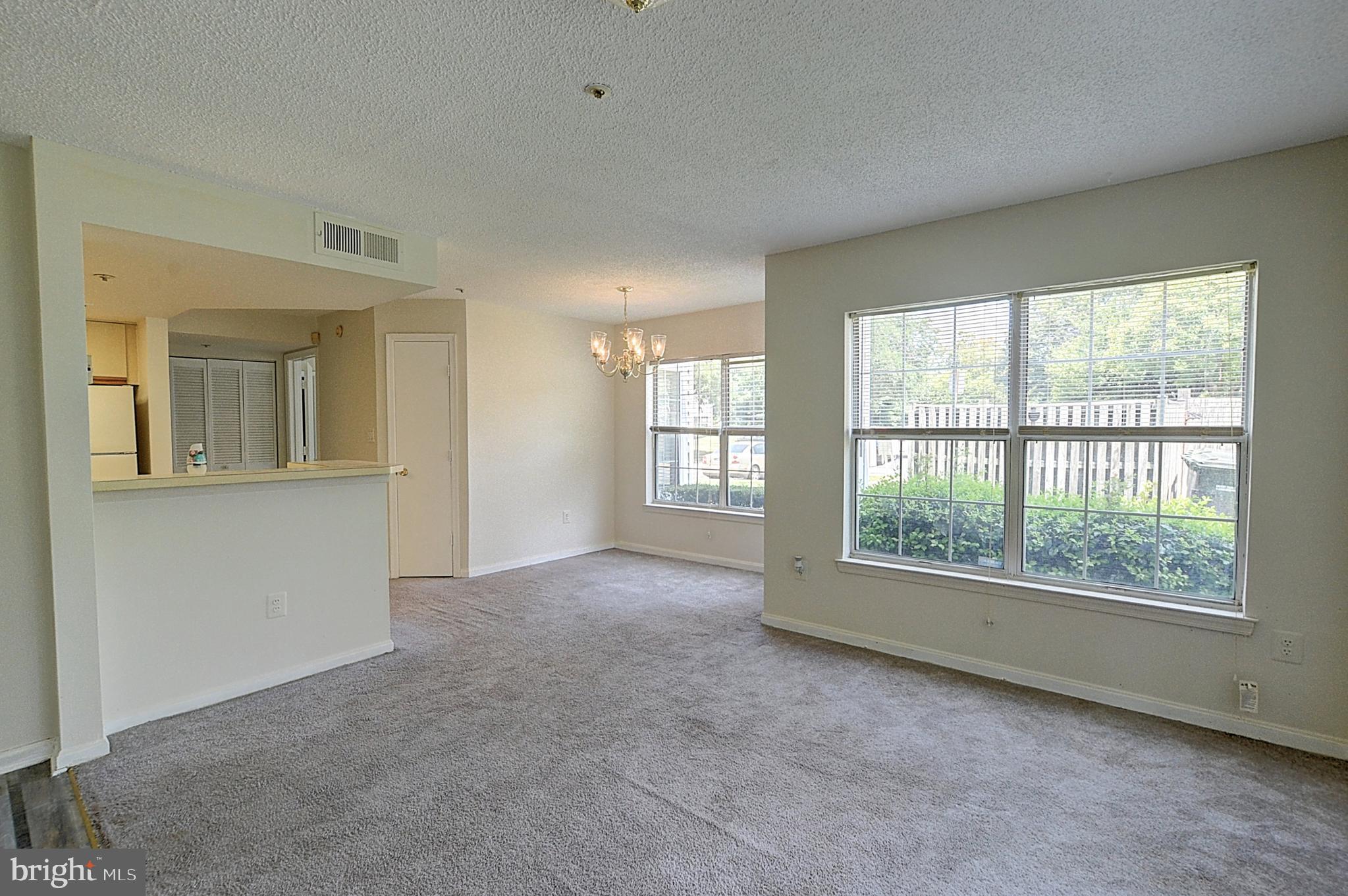 10401 Beacon Ridge Drive, Unit 101 Bowie, MD 20721 - Photo 2 of 14 Living Room/Dining Room